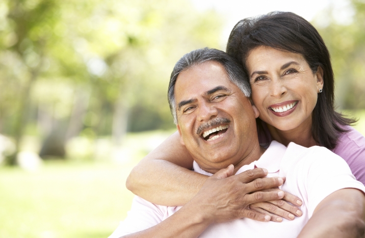 Man and woman with healthy smile after restorative dentistry