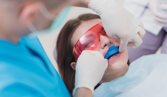 Dental patient receiving fluoride treatment