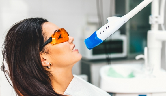 Dental patient receiving teeth whitening treatment