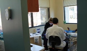 Dentist treating dental patient