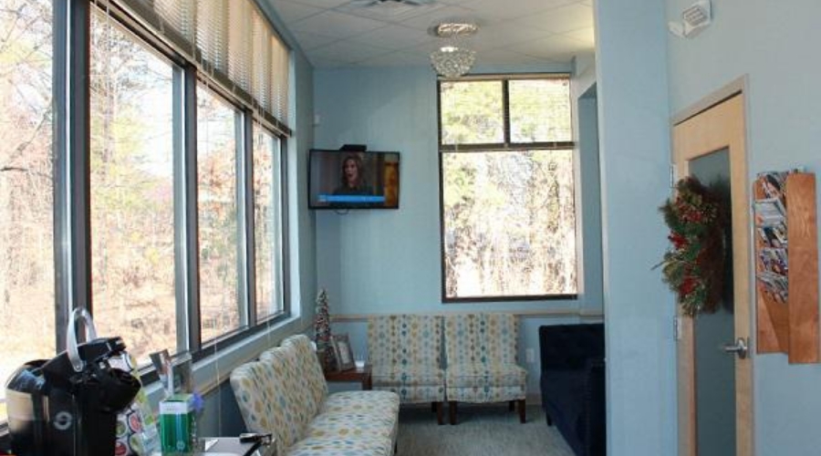 Row of comfortable chairs in dental office waiting room