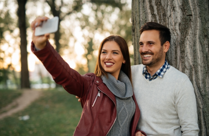 Man and woman with healthy smile after dental services