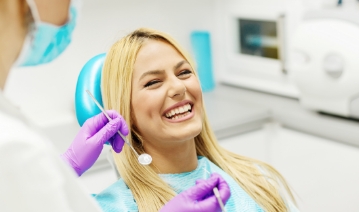 Woman laughing during preventive dentistry visit