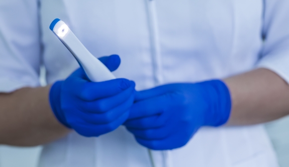 Dentist holding intraoral camera