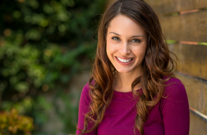 Woman with bright smile after teeth whitening